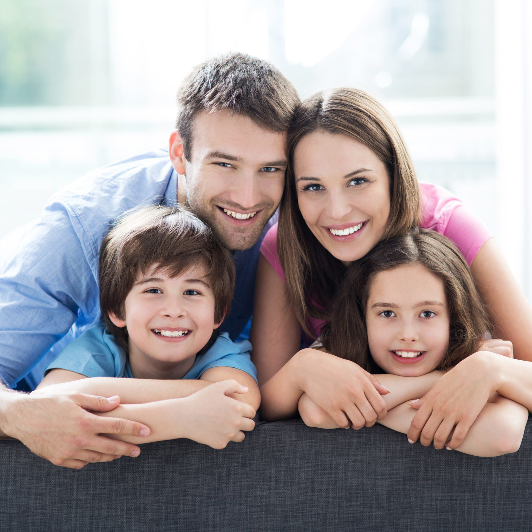 Family relaxing on sofa Family relaxing on sofa